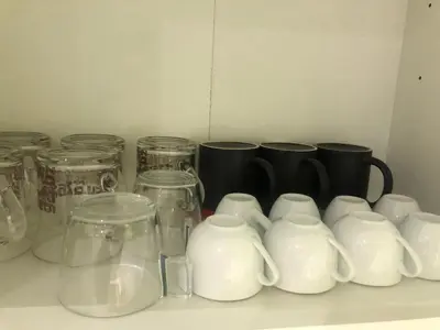 a group of glass jars and cups on a counter at Enjoy Valencia in Valencia