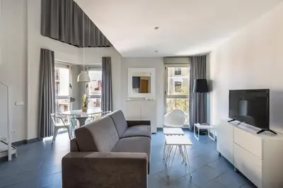 a living room with a couch and a tv at Stancia Carmen in Valencia