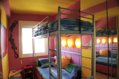 a bunk bed room with two bunk beds at Mareny Blau, primera linea de playa in Mareny Blau