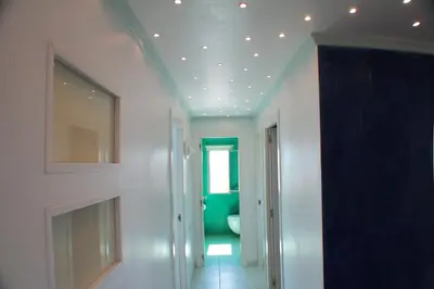 a room with a hallway with a ceiling with lights at Mareny Blau, primera linea de playa in Mareny Blau
