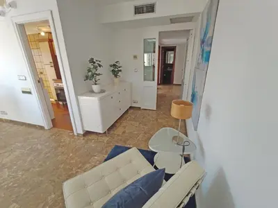 a living room with a couch and a table at Sunny apartment with fantastic terrace views! in Valencia