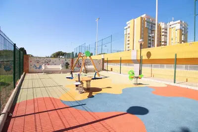 a playground with a play area with at Global Vacacional, Apartamento con buenas vistas en Canet playa in Canet de Berenguer