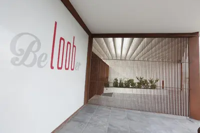 a lobby with a door with a sign on it at Hotel Loob Valencia in Mislata