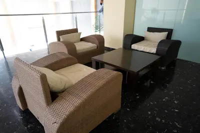 a living room with two chairs and a table at Hotel Lluna in Alzira
