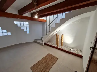 an empty room with a staircase with a rug at Alojamientos Segóbriga Rural ( Mandil) in Segorbe