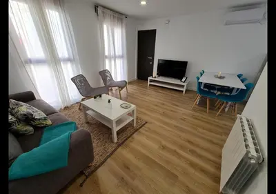a living room with a couch and a table at Alojamientos Segóbriga Rural ( Mandil) in Segorbe