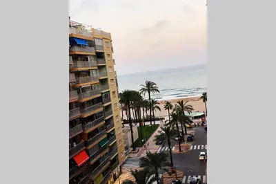 a view of a building and the ocean at 150m2 Con vistas al Mar y al Castillo de Cullera in Cullera