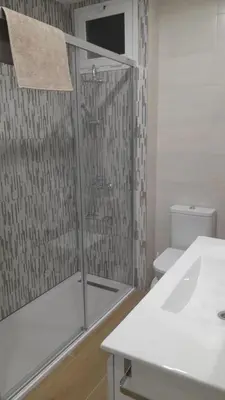 a bathroom with a shower and a sink and a toilet at 150m2 Con vistas al Mar y al Castillo de Cullera in Cullera