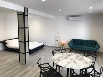 a room with a couch and a table and a bed at Sensaciones in Anna