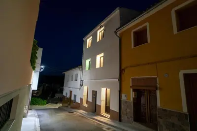 an empty alley with two buildings at night at Sensaciones in Anna