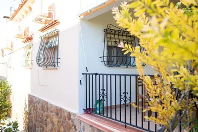 a balcony of a house with black balconies at FLORIT FLATS - The Orange Lemon Tree House in La Eliana