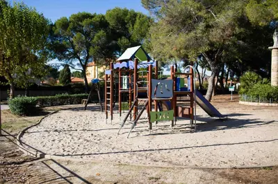 a playground with a slide in a park at FLORIT FLATS - The Orange Lemon Tree House in La Eliana