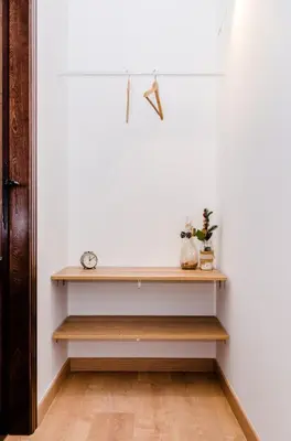 a shelf in the corner of a room at PALACIO Boutique in Anna