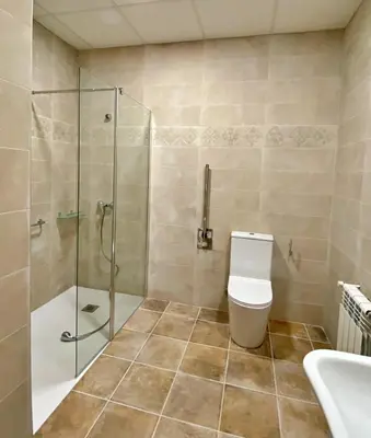 a bathroom with a shower and a toilet and a sink at PALACIO Boutique in Anna
