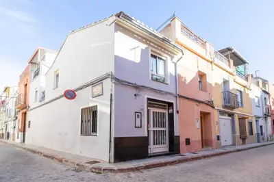a white building on the side of a street at Boutique House Alzira in Alzira