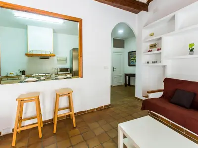 a living room with a couch and a mirror at Total Valencia Charming in Valencia
