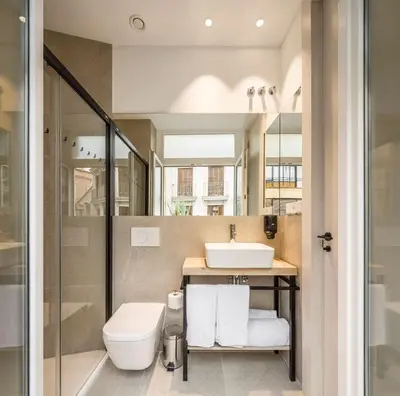 a bathroom with a toilet and a sink at Mon Suites Benlliure in Valencia