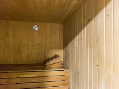 a sauna with wooden walls and a clock on the wall at Apartment Ana by Interhome in Cullera