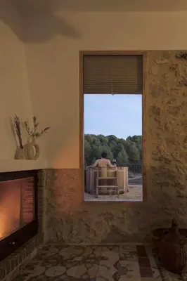 a room with a window with a view of a fence at Villa Serrano, La casa rural de los mil suelos in Valencia