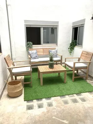 a patio with two chairs and a table and a bench at UIM Mediterraneo Buenavista Wifi in Puerto de Sagunto