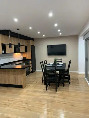 a kitchen and dining room with a table and chairs at UIM Mediterraneo Buenavista Wifi in Puerto de Sagunto