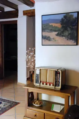 a tv sitting on a table in a living room at Casa de Pueblo El Patio de las Cebollas in Segorbe