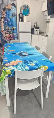 a table with a blue table cloth on top of it at A45 ViviendaTurísticaValencia Mundo in Valencia