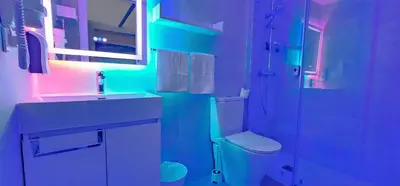 a bathroom with a sink and a shower and a toilet at A45 ViviendaTurísticaValencia Mundo in Valencia