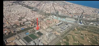 an aerial view of a city with a red arrow at A45 ViviendaTurísticaValencia Mundo in Valencia