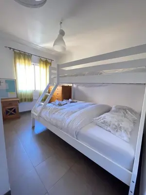 a white bunk bed in a room with a window at UIM Mediterraneo Churruca Wifi in Puerto de Sagunto
