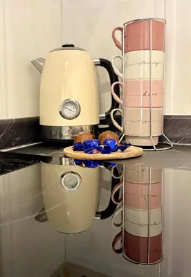 a counter top with a coffee maker and cups at Apartamento Mar y Montaña in Cullera