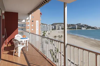 a balcony with a table and a view of the beach at El Raco, A-7-13 in Cullera