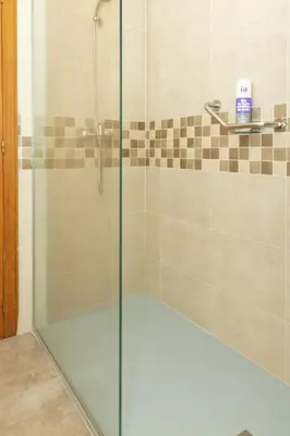 a shower with a glass door in a bathroom at Nereidas, A-2, 1-2 in Cullera