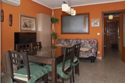 a living room with a table and a couch at Nereidas, A-2, 1-2 in Cullera