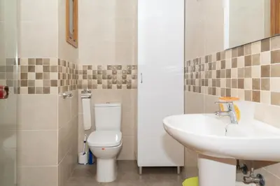 a bathroom with a toilet and a sink at Nereidas, A-2, 1-2 in Cullera