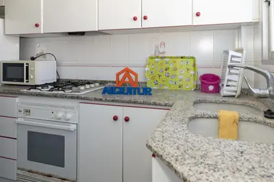 a kitchen with white cabinets and a counter top at El Raco, B-8-15 in Cullera