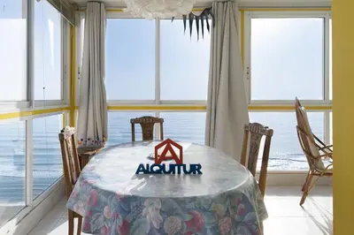 a dining room with a table with aania sign on it at Florazar-3, 14-E in Cullera