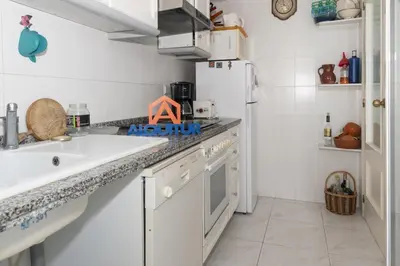 a kitchen with a sink and a refrigerator at Florazar-3, 14-E in Cullera
