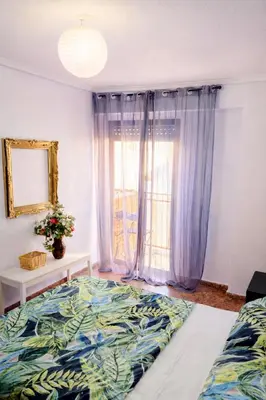 a bedroom with a bed and a window at Habitacion privada Valencia in Valencia