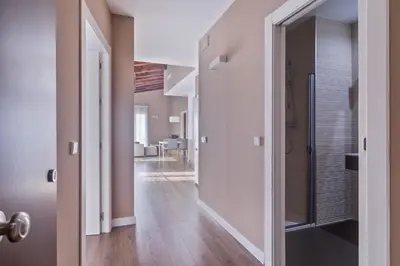 a hallway with a door leading into a house at San Miguel, Luxury apartments. in Valencia