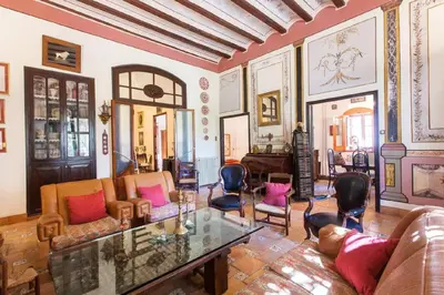 a living room with a couch and a table at Villa Charly Casa señorial XVII Historical Villa in Macastre
