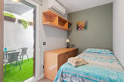 a room with a chair and two pictures on the wall at Burriana Centro in Burriana