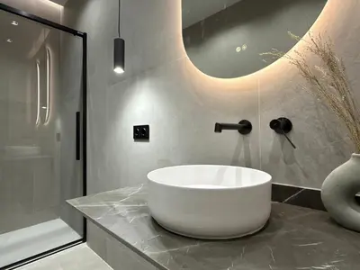 a bathroom with a white bowl sink on a counter at Apartamento Playa Valencia Beach in Valencia
