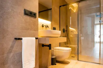a bathroom with a sink and a toilet at Valencia Luxury - Sea Port I in Valencia