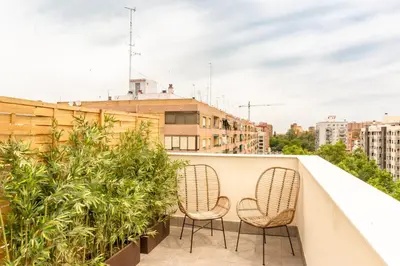 two chairs on a balcony with plants at Valencia Luxury - Sea Port I in Valencia