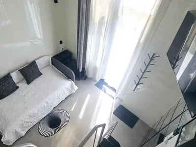 a small bedroom with a bed and a window at A6 ViviendaTuristicaValencia Ciencias in Valencia