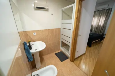 a bathroom with a sink and a mirror at Apartamento San cayetano in Torrent