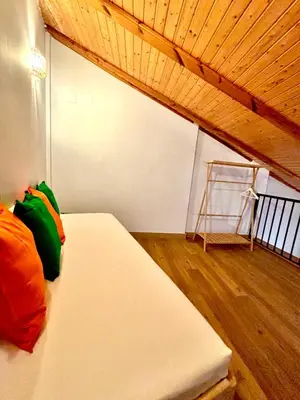 a bedroom with a bed and a wooden ceiling at Casa del Carmen in Valencia
