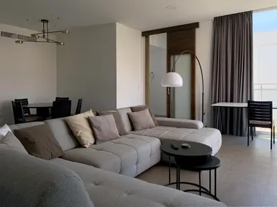 a living room with a couch and a table at Villa with magnificants sea views on Cullera bay. in Faro de Cullera