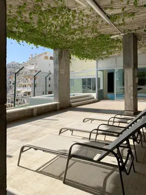 a group of benches sitting on a roof at Villa with magnificants sea views on Cullera bay. in Faro de Cullera